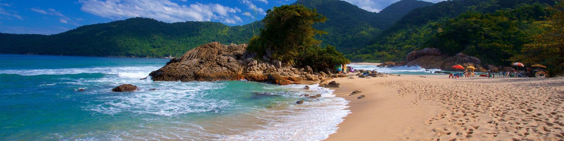 Meio Beach showing rugged coastline, a sandy beach and general coastal views
