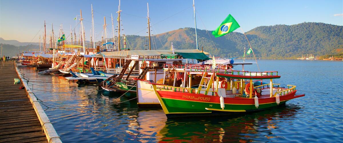 Paraty Wharf featuring a sunset and a bay or harbor