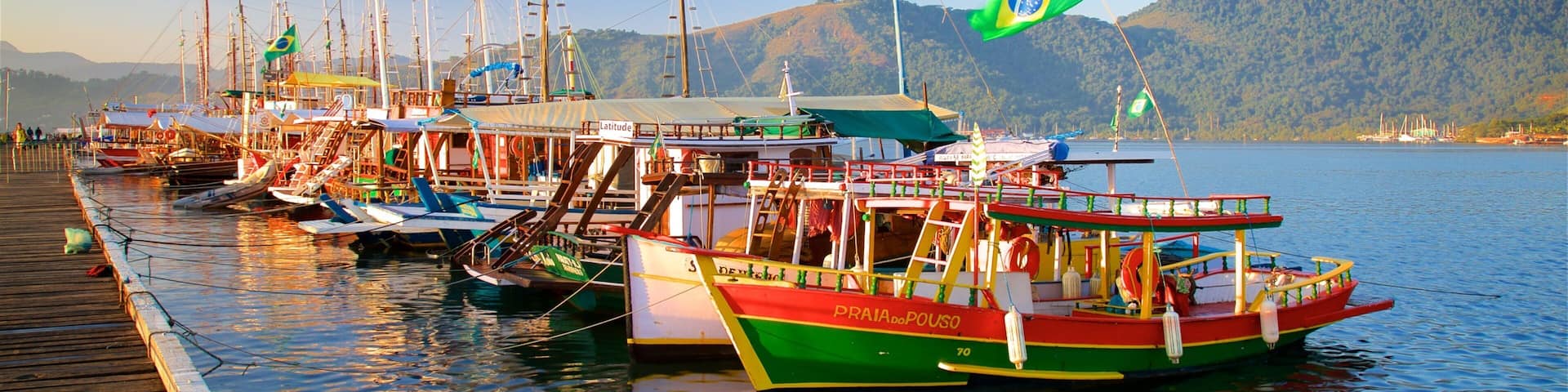Paraty Wharf featuring a sunset and a bay or harbor
