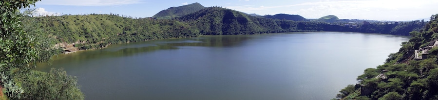 Panoramic view encompassing the forested and hilly shores of Lake Bishoftu, a crater lake in central Ethiopia south of Addis Ababa