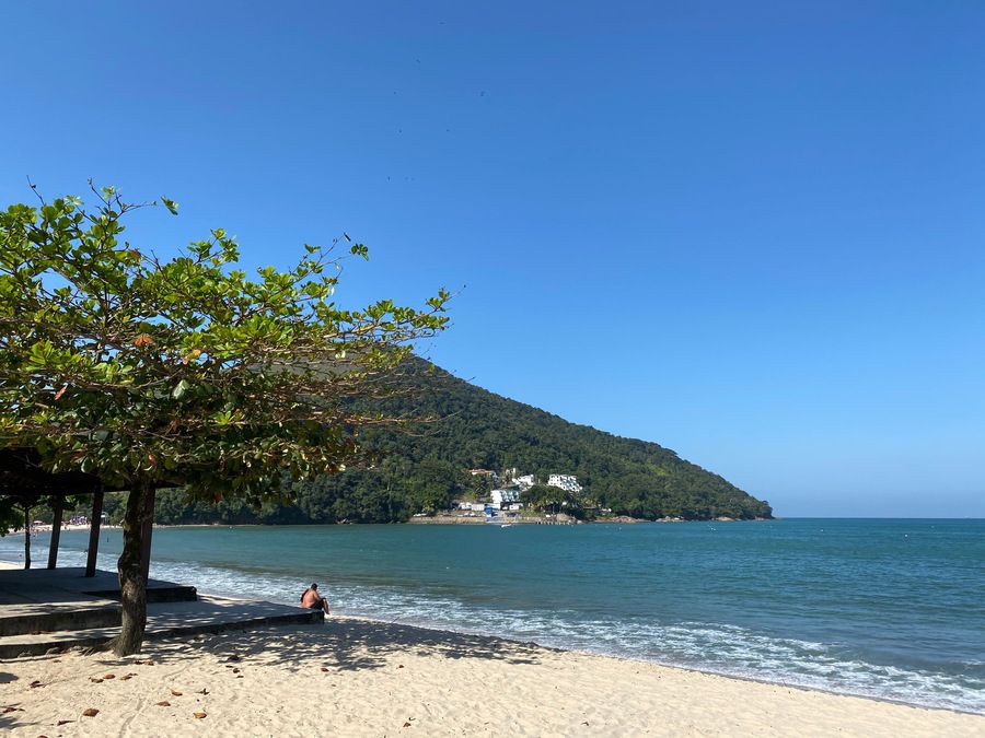Man resting in Martim de Sá beach during Coronavirus pandemic. Caraguatatuba city, North coast of Sao Paulo state, Brazil.