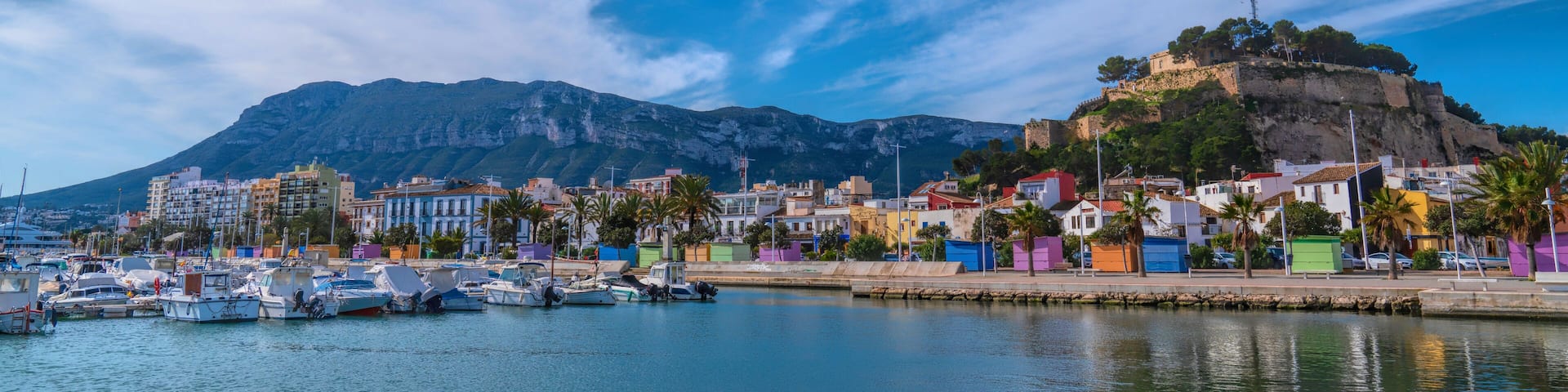 Denia Spain panoramic view castle Alicante with colourful houses and mountain and beautiful blue sky