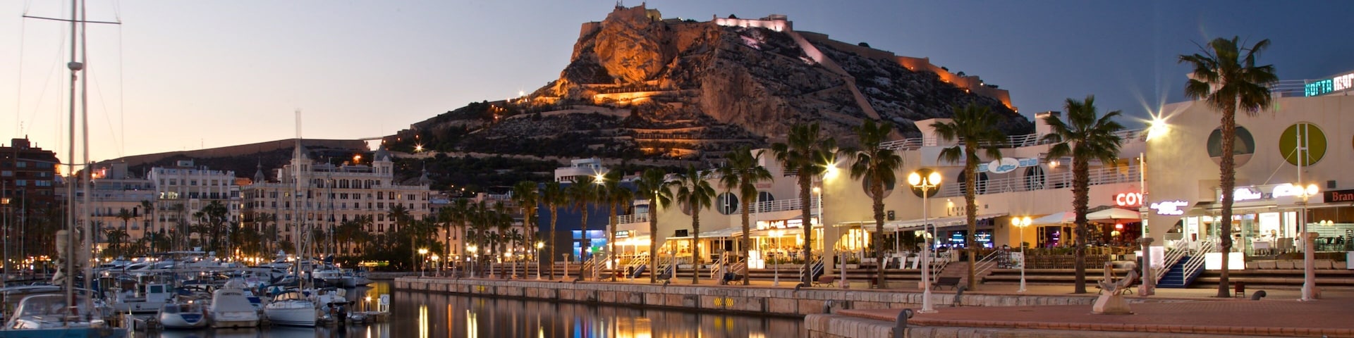 Alicante which includes a sunset and a bay or harbor
