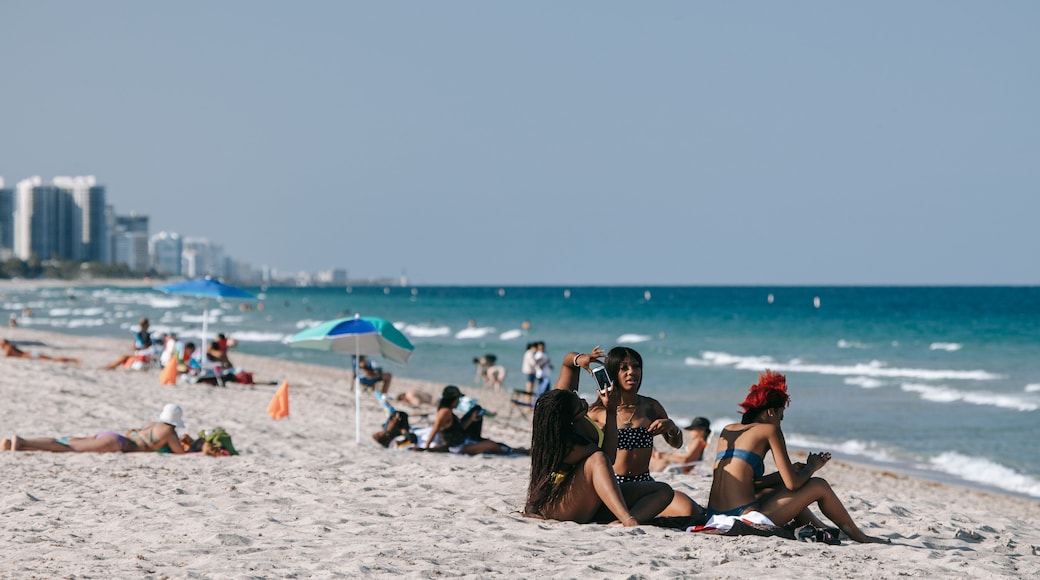 Fort Lauderdale Beach featuring general coastal views and a beach as well as a small group of people