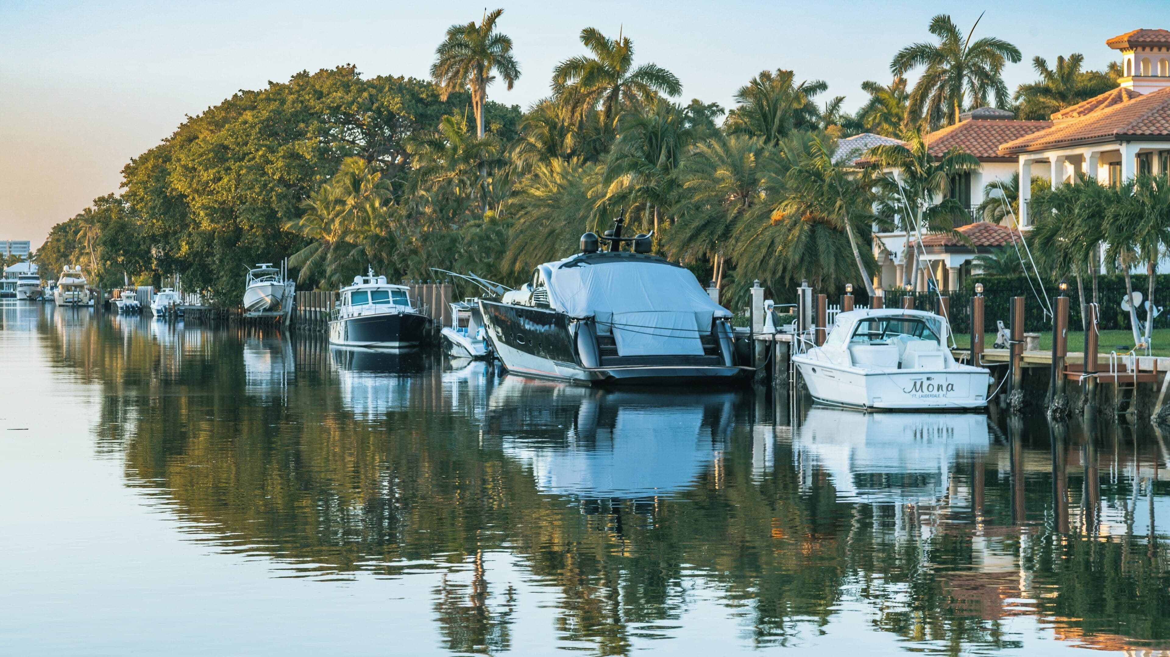 Stunning view of Las Olas Boulevard's waterfront homes and boats in Fort Lauderdale, Florida during golden hour