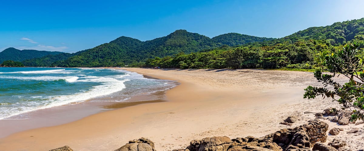 Panoramic image of Praia Branca (White Beach) located in the city of Bertioga and surrounded by rainforest on the coast of Sao Paulo, Brazil