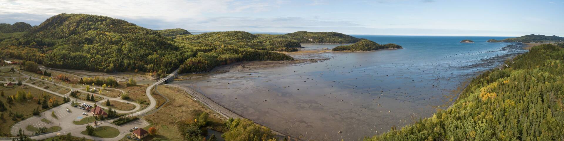 Aerial panoramic landscape view of Bic National Park during a vibrant sunny day. Taken in Le Bic, Rimouski, Quebec, Canada.
