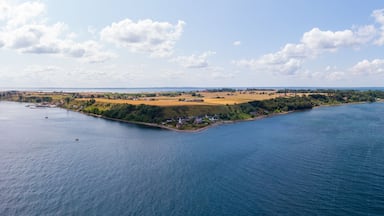 Aerial panorama of the island of Ven in southern Sweden during a warm summer day with Haken lighthouse as the center.