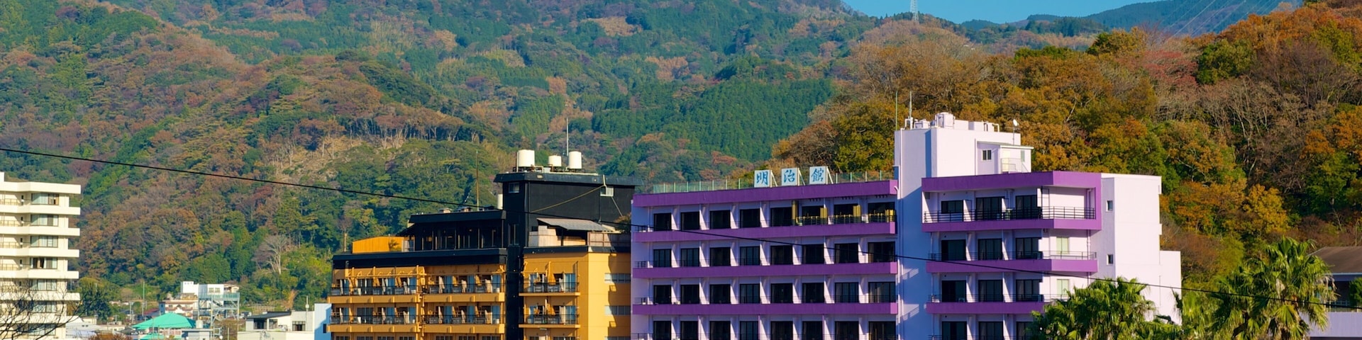 Toi Beach which includes a hotel, mountains and a beach