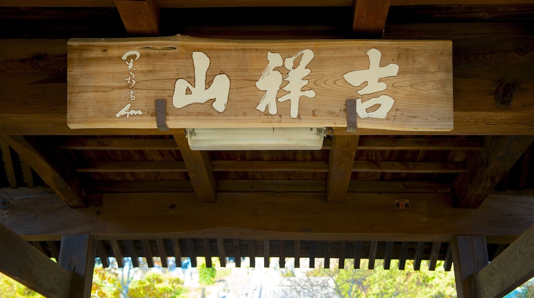 Anrakuji Temple which includes a temple or place of worship, religious aspects and signage