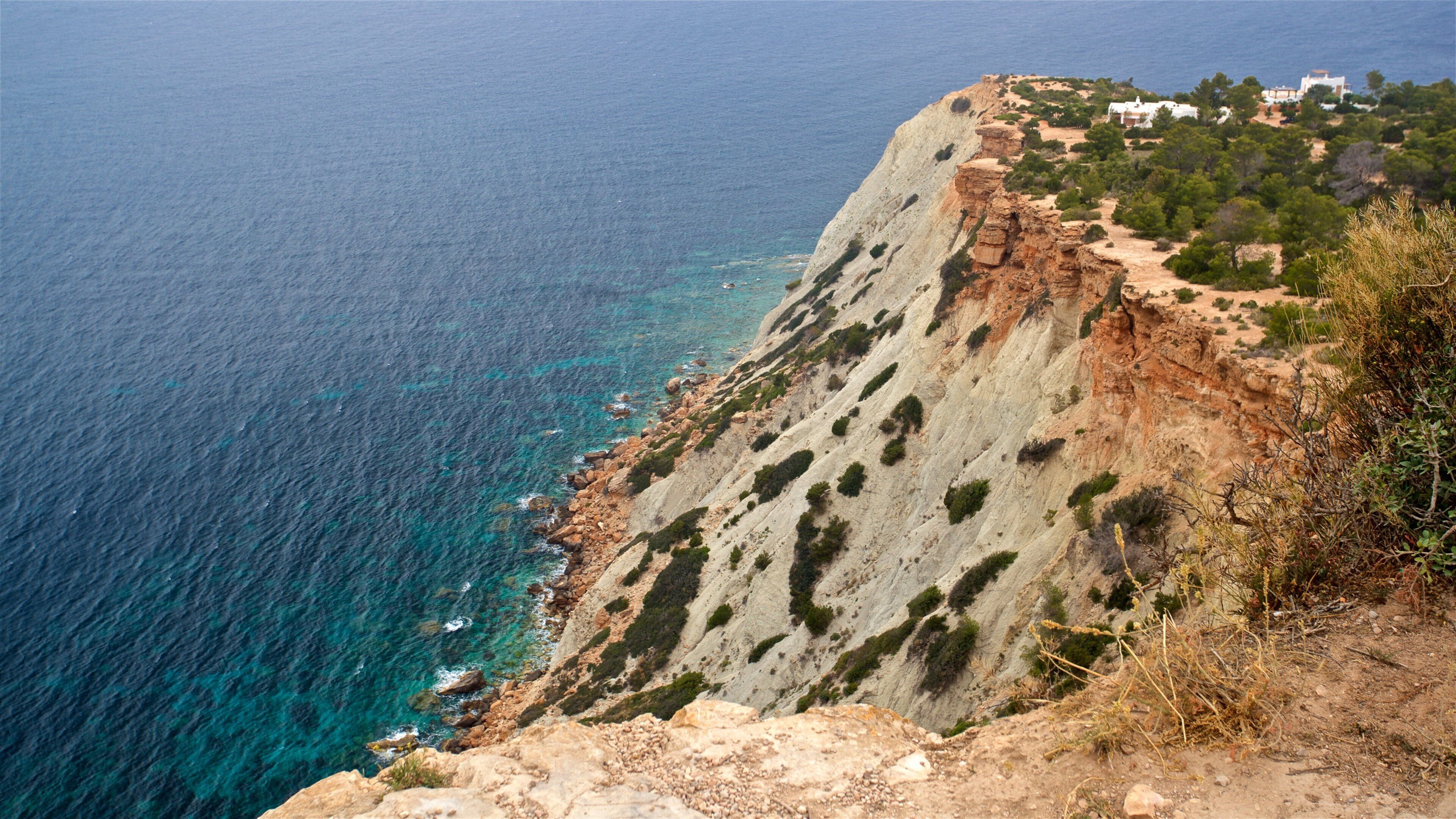 Es Vedra which includes general coastal views, landscape views and rocky coastline