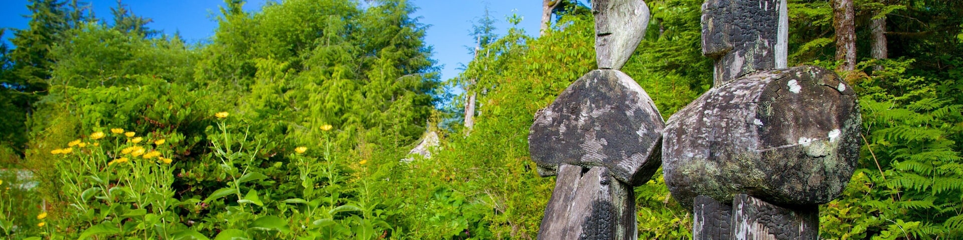Tofino Botanical Gardens featuring a garden and outdoor art