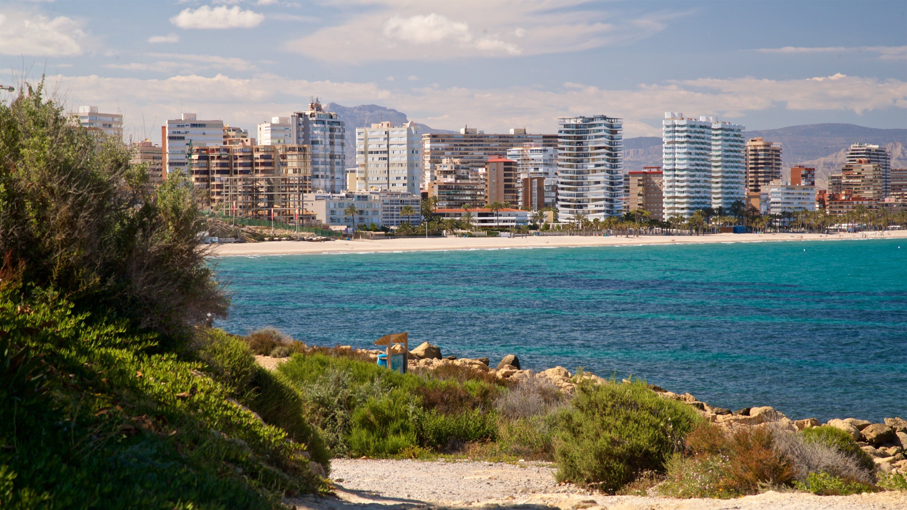 Cabo de las Huertas showing a coastal town and general coastal views