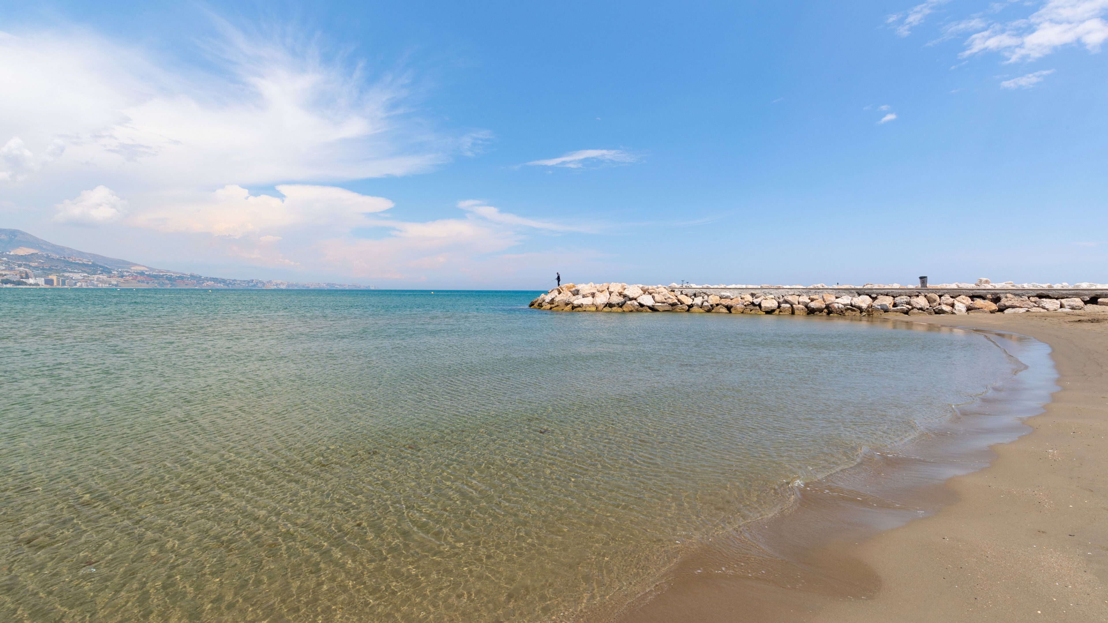 Los Boliches Beach which includes general coastal views and a sandy beach