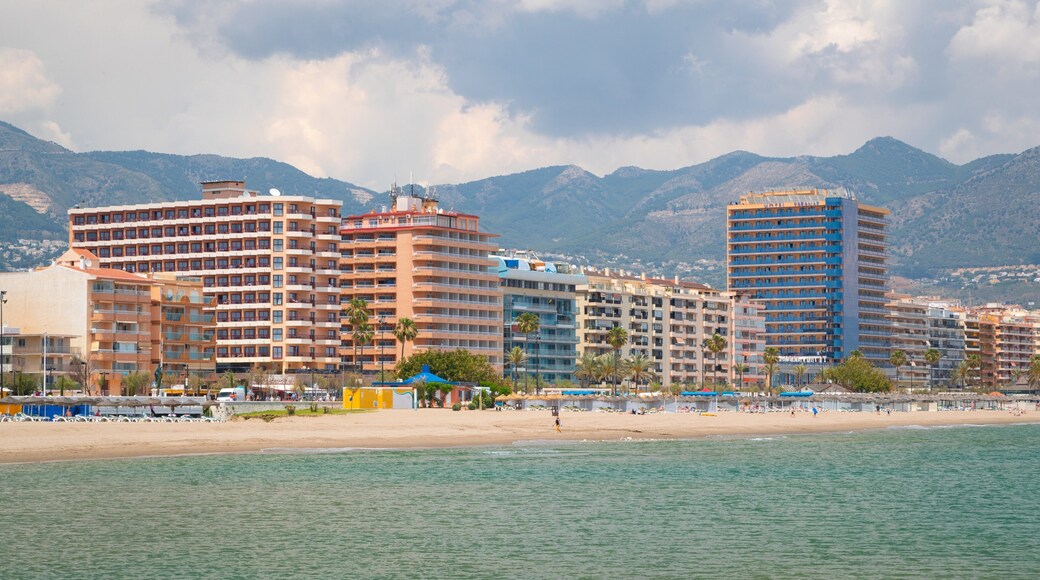 Los Boliches Beach which includes general coastal views, a sandy beach and a coastal town