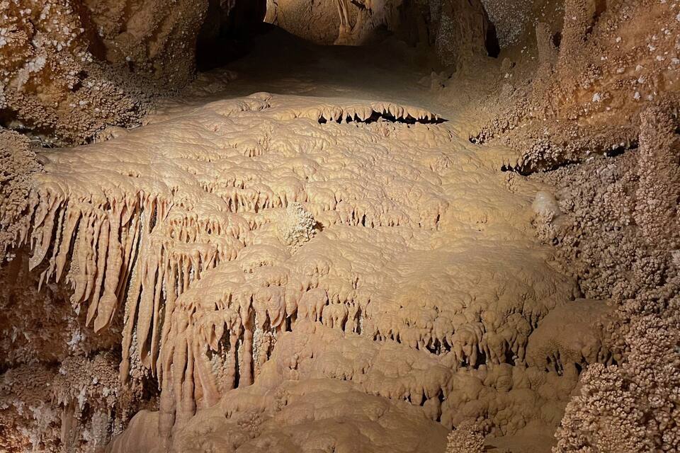 A cave with stalactites and stalagmites.