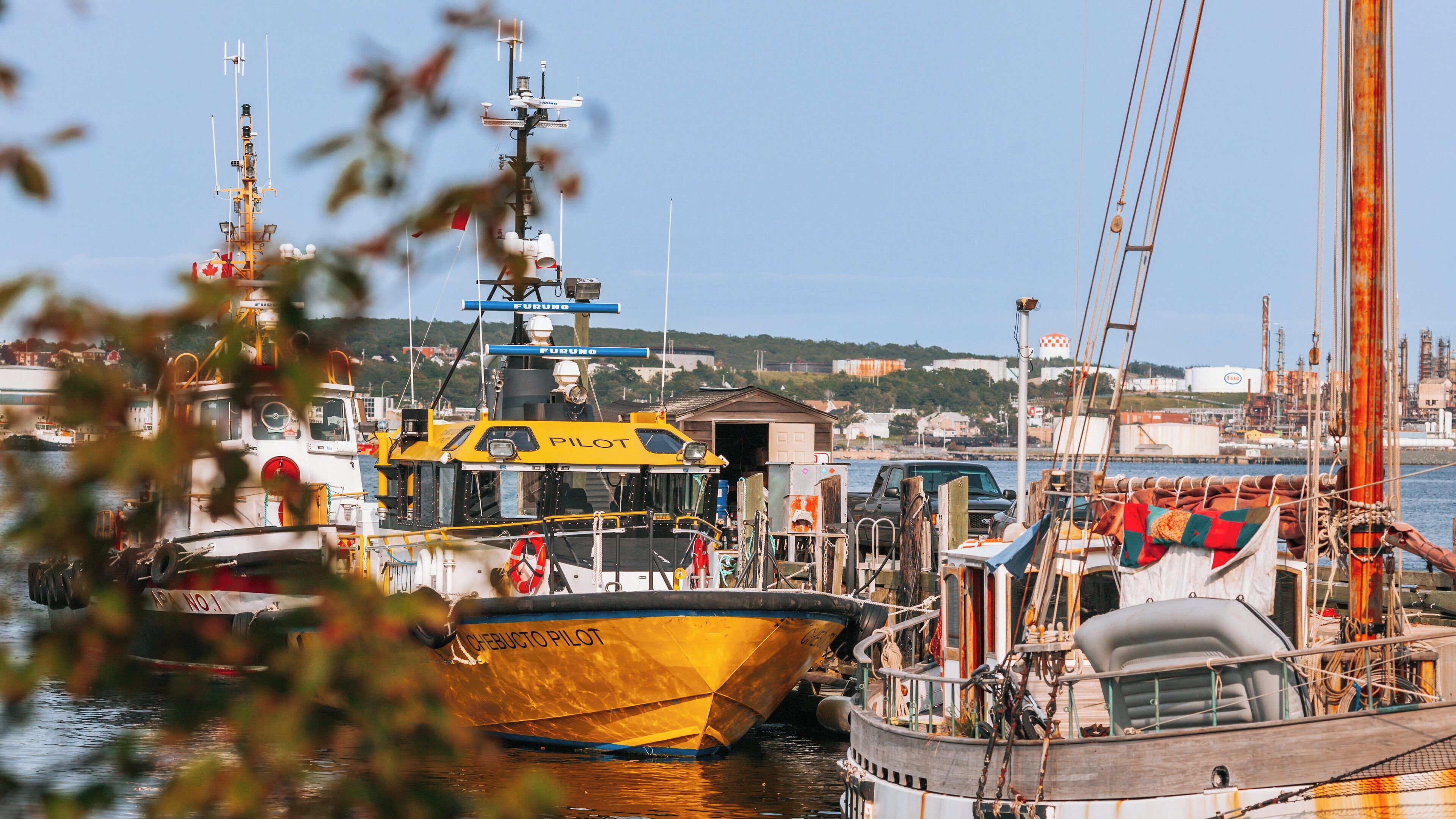 Explore the vibrant Halifax Waterfront Boardwalk with its bustling activity and picturesque views in Downtown Halifax, Nova Scotia