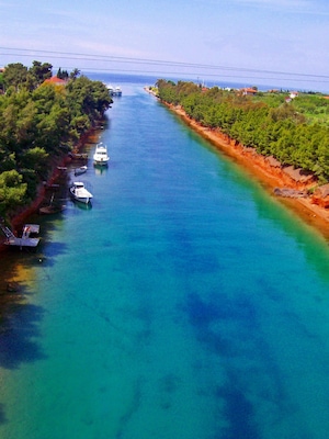 Big seaside village in the prefecture of Halkidiki, built at the place of the ancient Potidea, which was colony of Corinth in the 7th century BC. In New Potidea visitors will see the canal that connects Thermaikos with Toroneo bay. The area is a well-known summer destination since it has very beautiful sea , and is a very famous tourist destination. We recommend you to visit the chapel of the Archangels, which has been constructed in 1872.