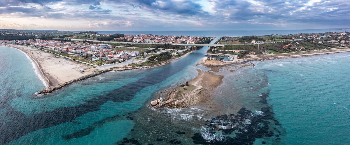 Aerial view at Nea Potidea canal, which connects Toroneos Bay with the Gulf of Thermaikos. Greece, Kassandra, Halkidiki