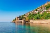 Landscape of ancient shipyard near of Kizil Kule tower in Alanya peninsula, Antalya district, Turkey, Asia. Famous tourist destination with high mountains. Part of ancient old Castle.