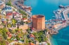 Landscape with marina and Kizil Kule tower in Alanya peninsula, Antalya district, Turkey