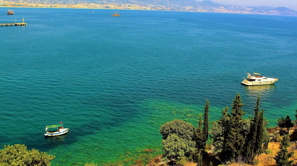 I took this photo in Alanya, Turkey last June! It's a great view from the Alanya Castle walls! I loved walking by and seeing the beautiful, colorful sea. And the great Taurus Mountains in the distance. And all the lovely boats passing by. It was a very hot summer day, but the views made it worthwhile. And the sense of adventure! :)