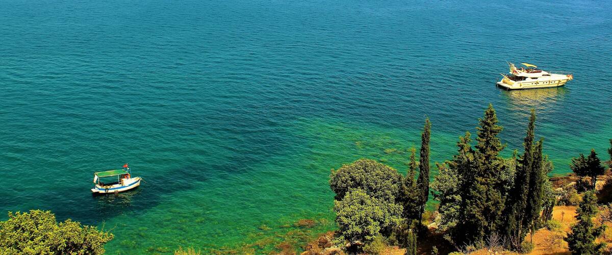 I took this photo in Alanya, Turkey last June! It's a great view from the Alanya Castle walls! I loved walking by and seeing the beautiful, colorful sea. And the great Taurus Mountains in the distance. And all the lovely boats passing by. It was a very hot summer day, but the views made it worthwhile. And the sense of adventure! :)