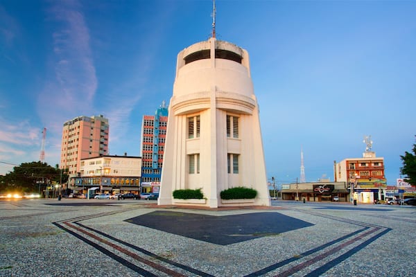 Castle Tower which includes a square or plaza and a sunset