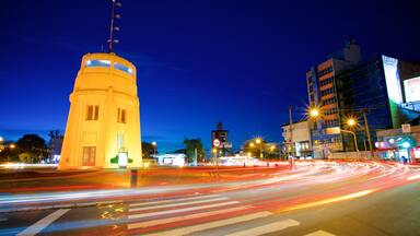 Castle Tower featuring a city and night scenes