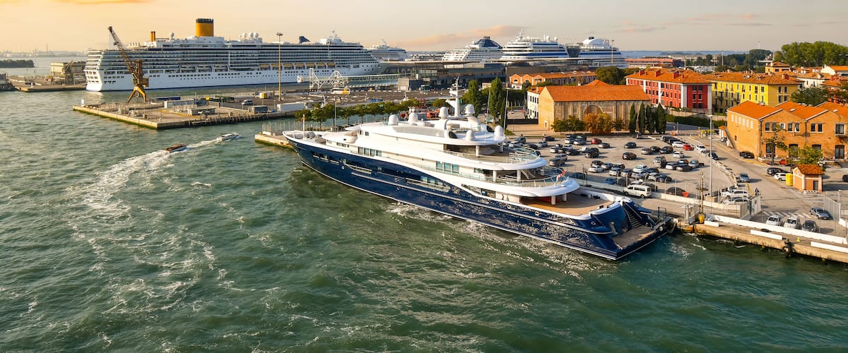 Late afternoon, early evening view of the Venice cruise port with at least five large cruise ships in port, Venice, Italy.