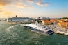 Late afternoon, early evening view of the Venice cruise port with at least five large cruise ships in port, Venice, Italy.