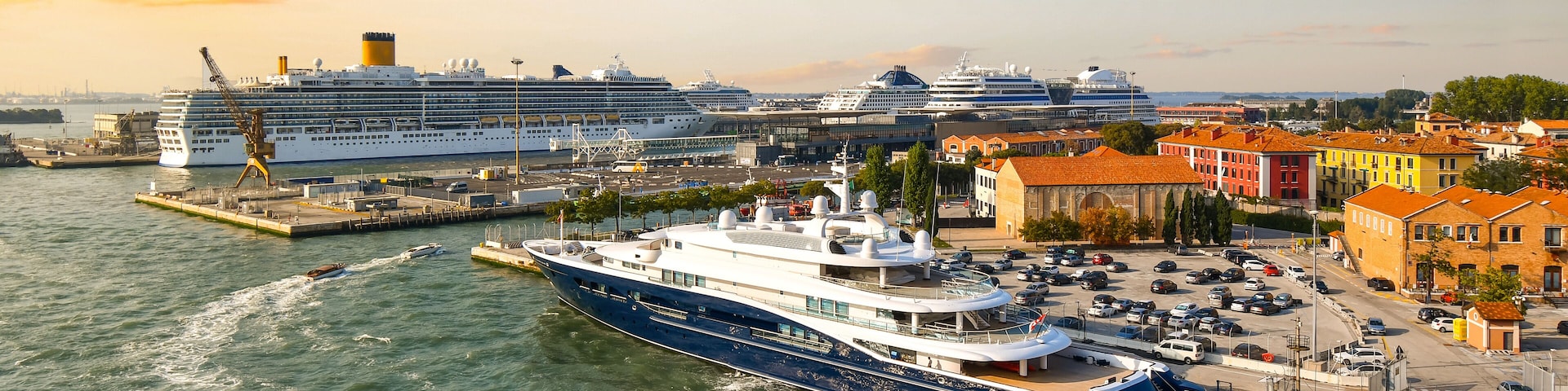 Late afternoon, early evening view of the Venice cruise port with at least five large cruise ships in port, Venice, Italy.