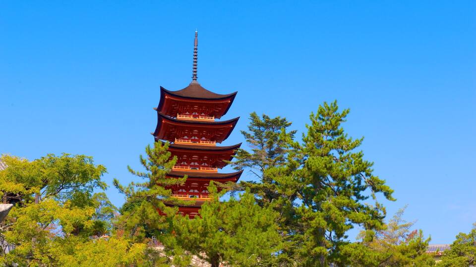 A traditional multi-tiered pagoda surrounded by lush green trees.