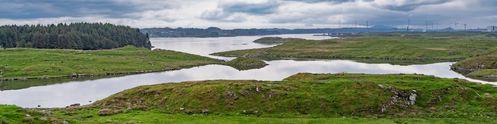Panorama of the beautiful landscape of the island of Karmoy in Rogaland, Norway, with dark cloudy sky