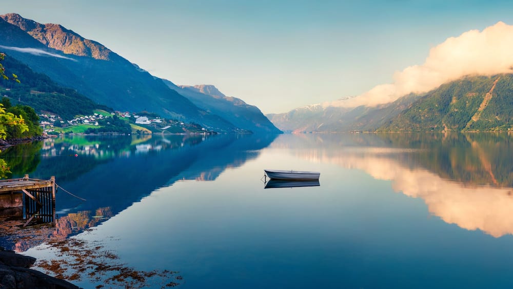 Beautifel summer panorama on the Norwegian fjord, located near Lofthus village in Ullensvang municipality, Hordaland county, Norway. Beauty of countryside concept background.