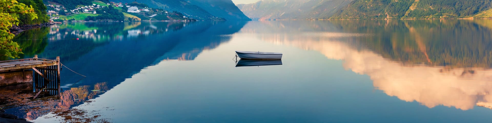 Beautifel summer panorama on the Norwegian fjord, located near Lofthus village in Ullensvang municipality, Hordaland county, Norway. Beauty of countryside concept background.