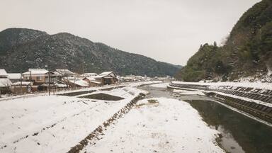 The tsuwano bridge that people used to travel was covered by snow after a blizzard.