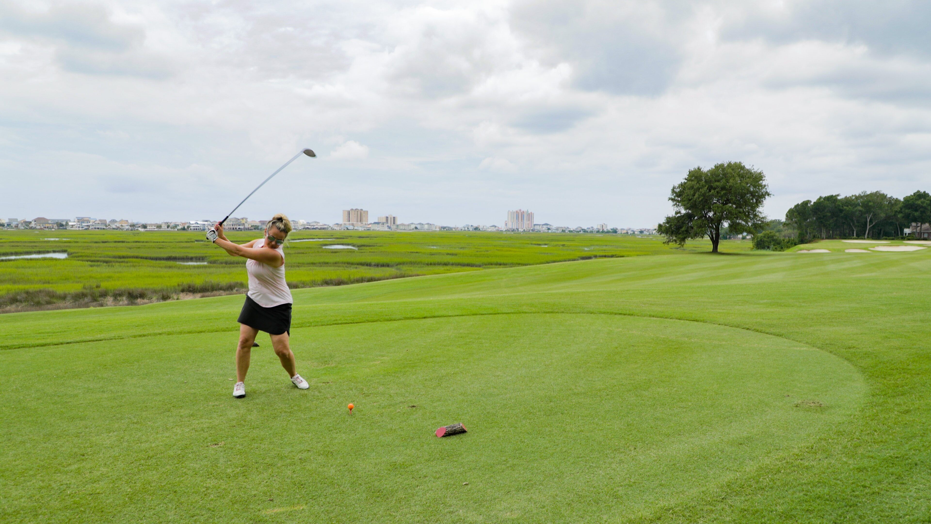 Tidewater Golf Club showing golf as well as an individual femail