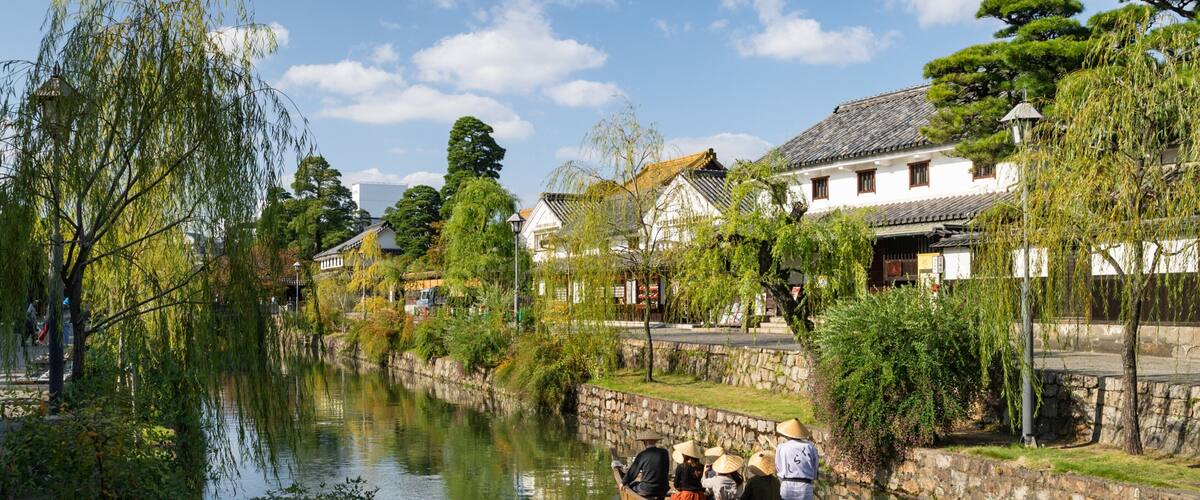 Bikan Historical Area which includes a small town or village, a river or creek and boating