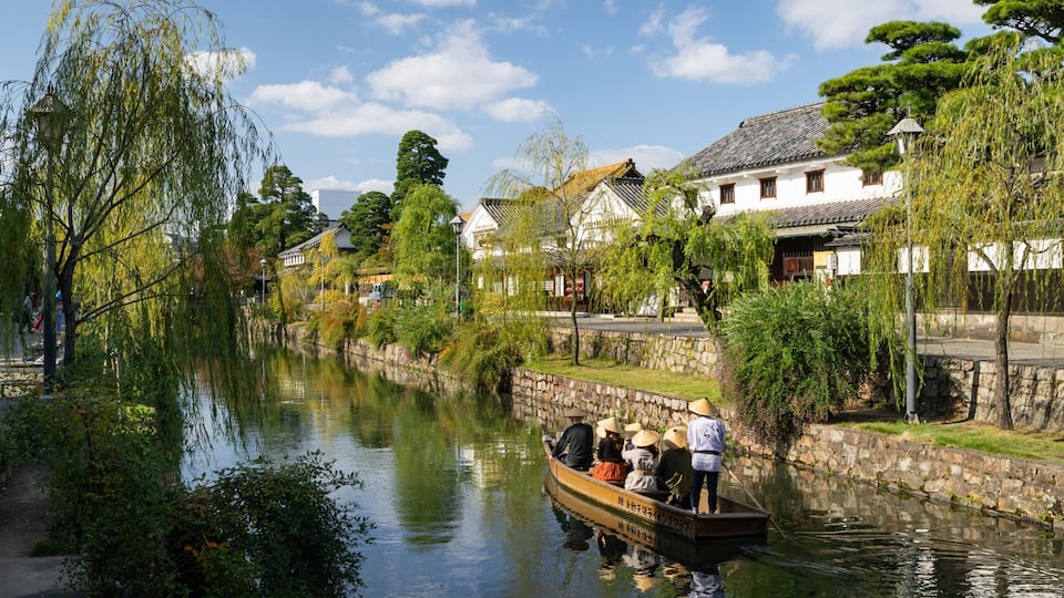 Bikan Historical Area which includes a small town or village, a river or creek and boating