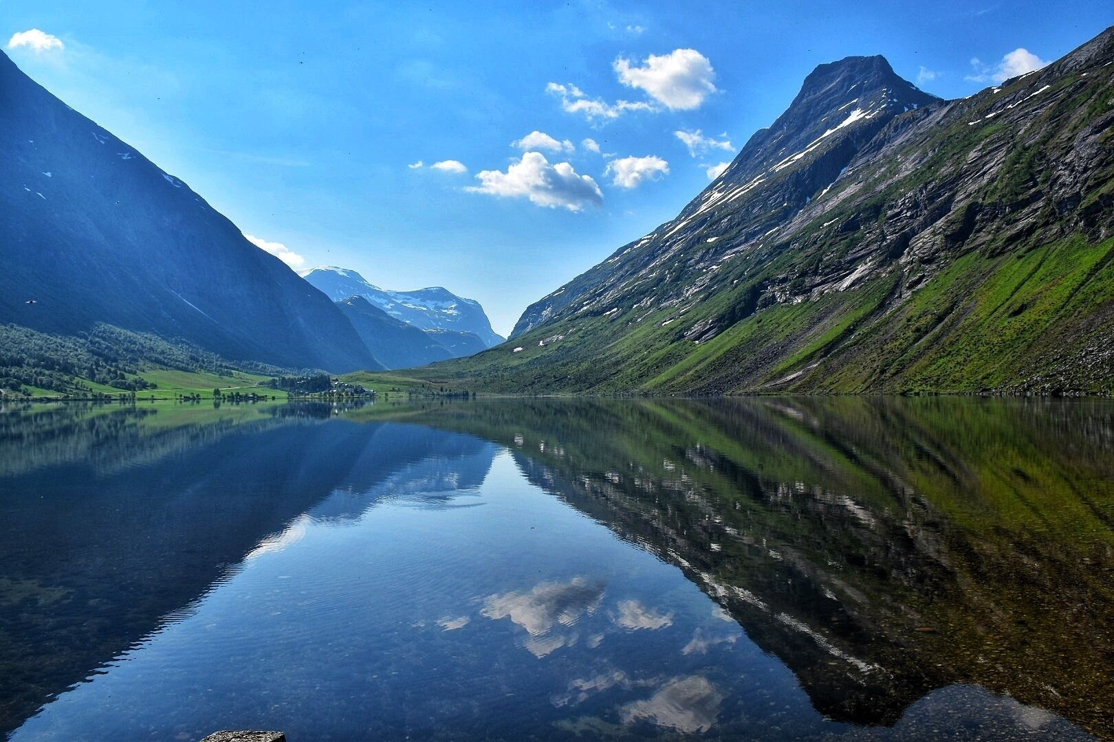 On a recent trip to Norway I came across this view on a drive towards Geirangerfjord. The reflection on the Eidsvatnet lake was mesmerising. #reflection #BVSblue #photo #lake #travel #roadtrip #Norway 
