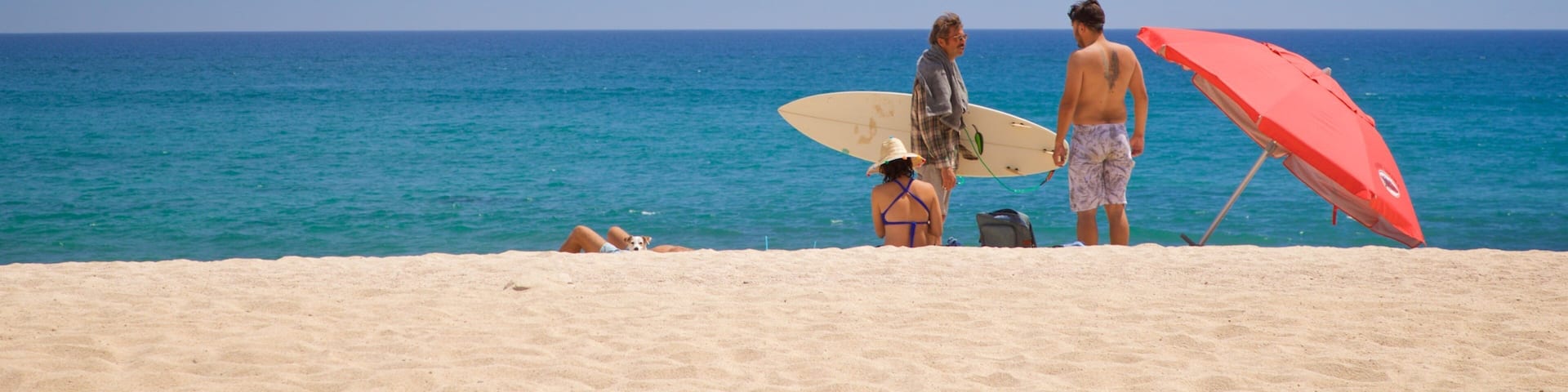 Costa Azul Beach showing general coastal views and a sandy beach as well as a small group of people