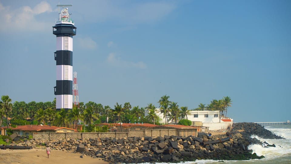 Pondicherry Lighthouse featuring a sandy beach, a lighthouse and rocky coastline