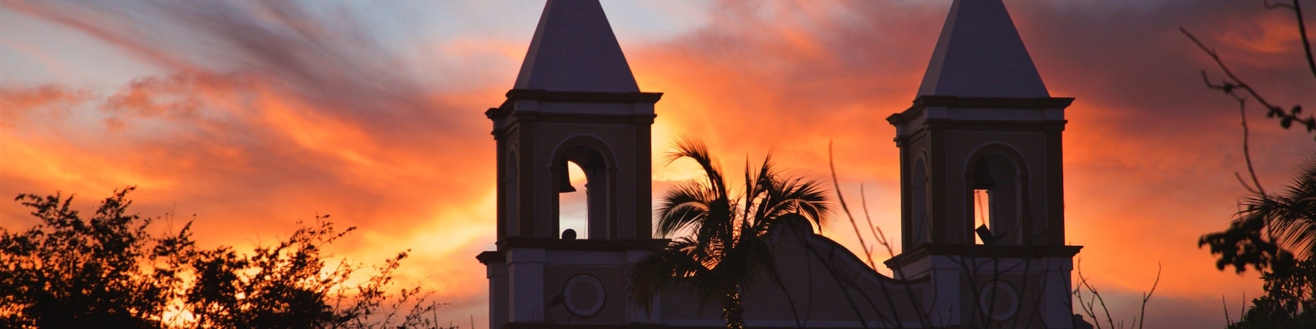 Mission of San Jose featuring a sunset and a church or cathedral