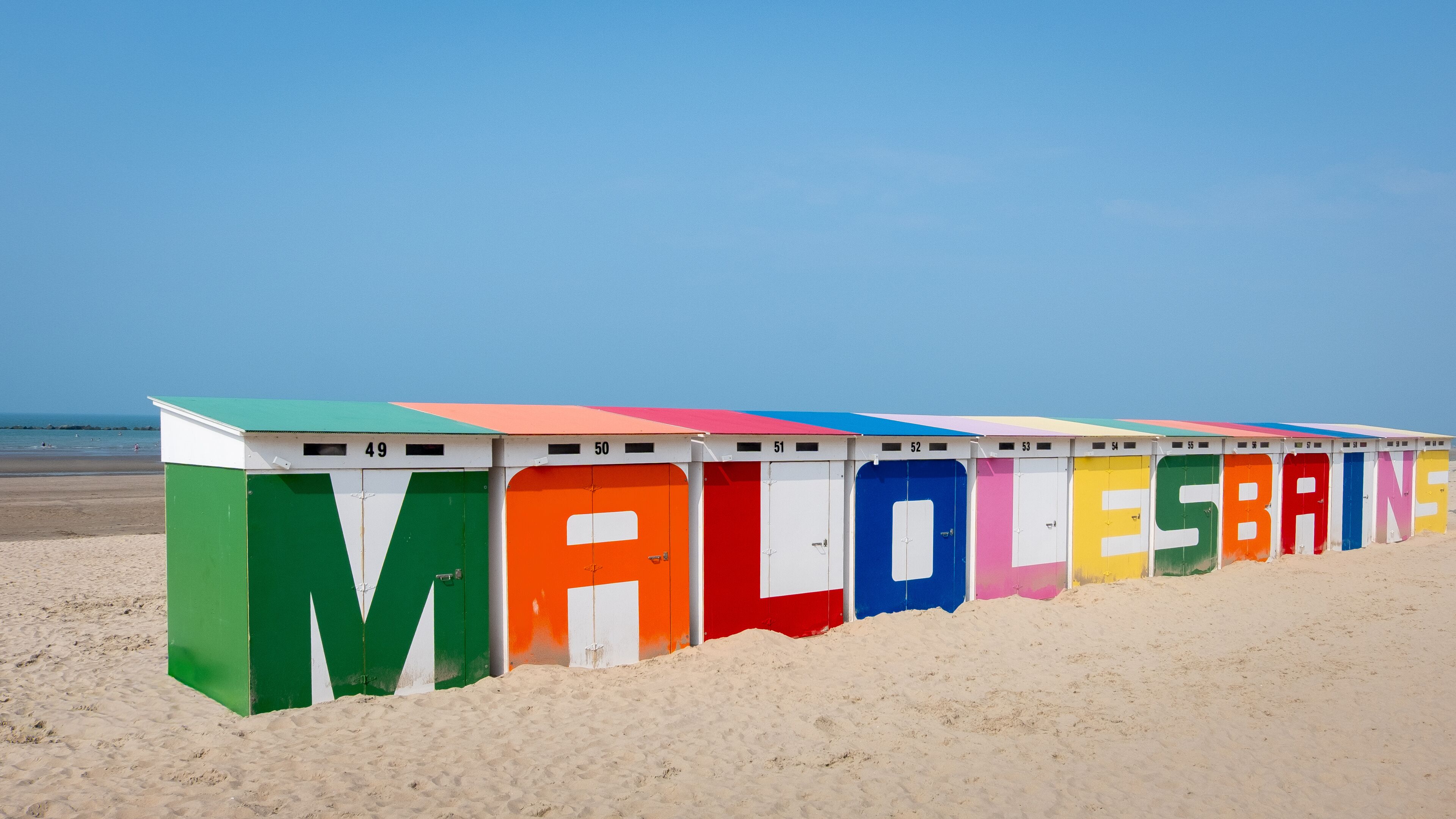 Colorful beach huts on sandy beach in Malo-les-Bains, Dunkirk, France
