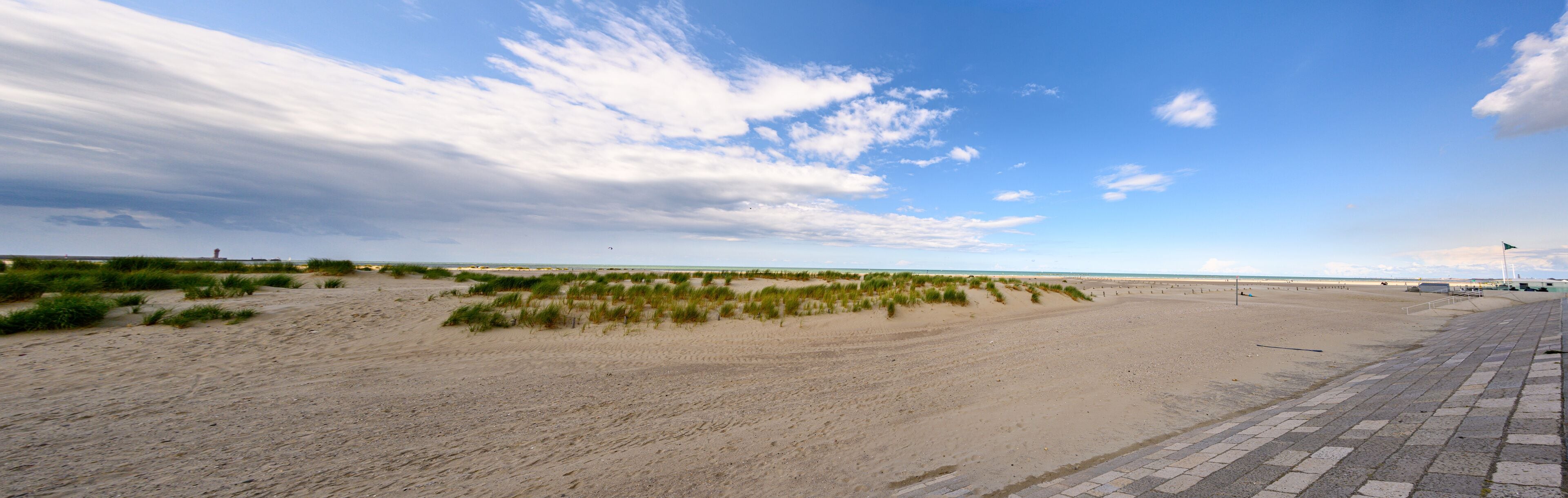 Panorama of sand dunes and the beach at Dunkirk, France