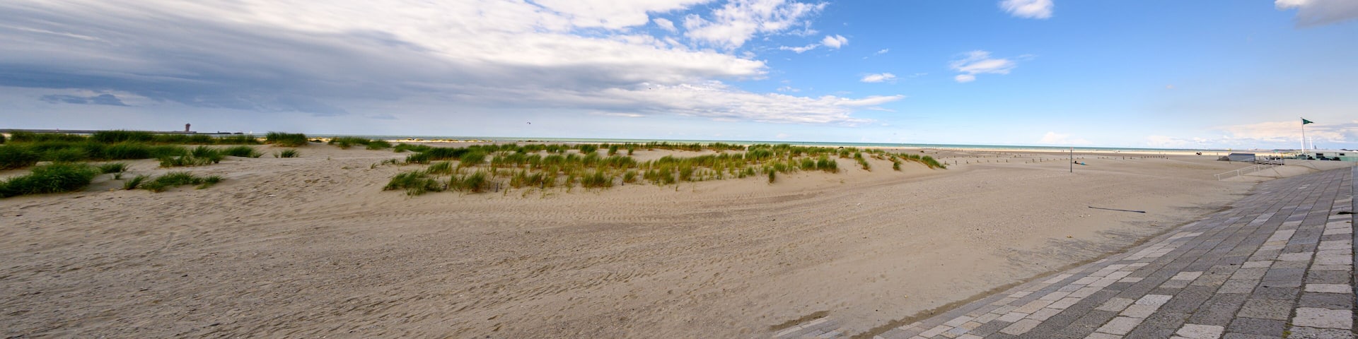Panorama of sand dunes and the beach at Dunkirk, France