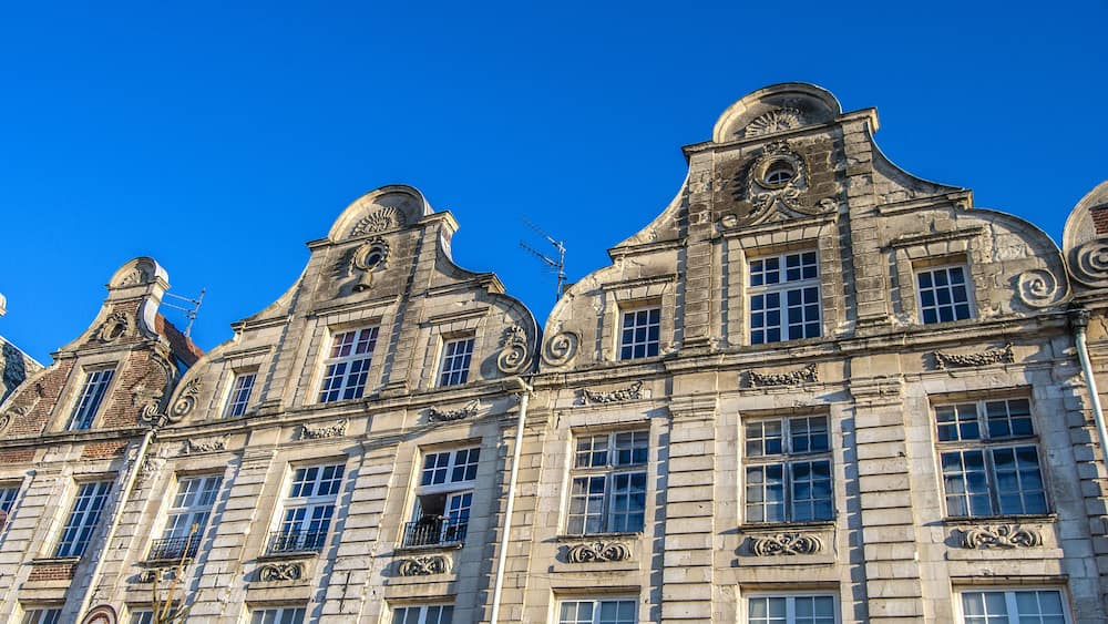 A historic building with ornate architectural details and multiple windows.