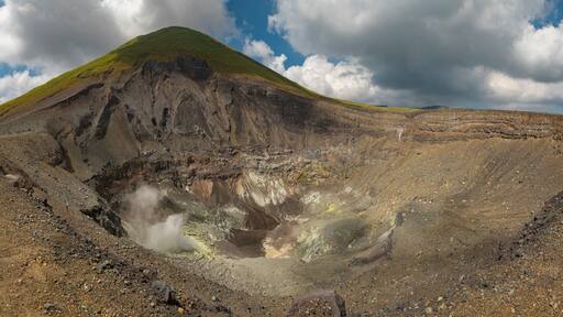 Panoramic view and natural landscape of the active crater of Lokon volcano, one of the twin volcanoes located in the Tondano plain near Tomohon, Minahasa Regency, North Sulawesi, Indonesia