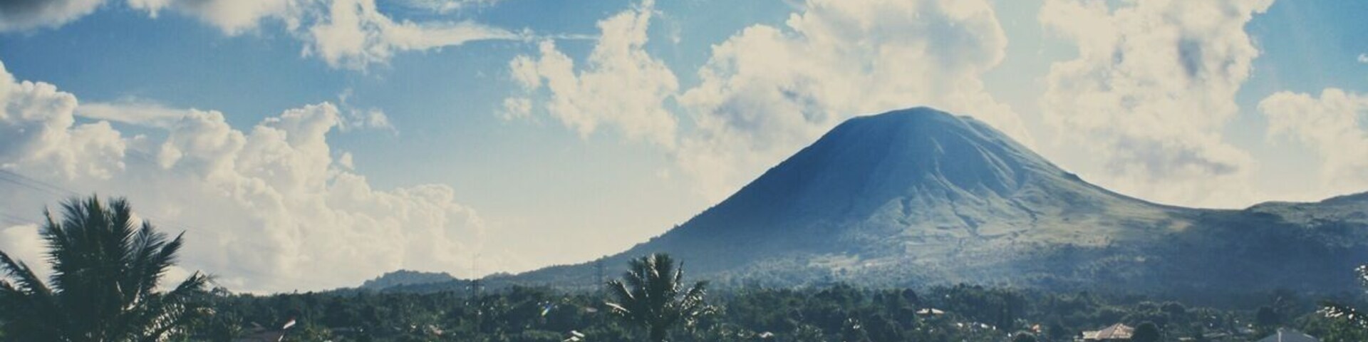 • Mount Lokon •
Mount Lokon is an active volcano and located in Minahasa Highlands. The nearest city from this mountain is Tomohon, where is 1 hour drive from Manado (The capital of North Sulawesi).
The last eruption that this mountain had was last year.
Where to stay?
You may stay in Manado or some local cottages in Tomohon.
What to do?
Tomohon is a unique city that offers you a magnificent combination of religious and natural sites. There are many beautiful religious sites (Christian and Catholic) and there are many amazing natural sites like Pine forest, Linow Lake, Tondano Lake, Mahawu volcanic hole, hot springs, and other adventurous sites.
Food is awesome!
- Parakletos Fried Banana
- Von-Von Ragey (pork satay)
- Dessert at House of Kitty or Green Garden, and so much more!